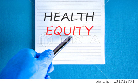 Health equity symbol. Concept words Health equity on beautiful white note. Doctor's hand in blue medical glove. Black pen. Beautiful blue background. Medical healthy lifestyle health equity concept 131718771