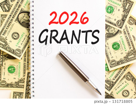 2026 Grants symbol. Concept words 2026 Grants on beautiful white note. Beautiful dollar bills background. Black pen. Dollar bills. Business and 2026 grants concept. Copy space. 2026 Grants symbol. Concept words 2026 Grants on beautiful white note. Beautiful dollar bills background. Black pen. Dollar bills. Business and 2026 grants concept. Copy space. 131718805