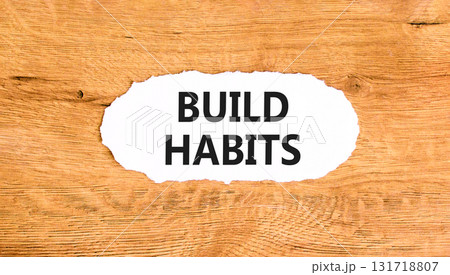 Build habits symbol. Concept word Build habits on beautiful white paper. Beautiful wooden paper background. Business build habits concept. Copy space. 131718807