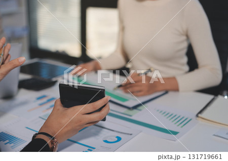 Accounting company provide finance and taxation planning for profitable cash flow, Auditor and accountant team working in office, analyze financial data and accounting record with calculator.Insight 131719661