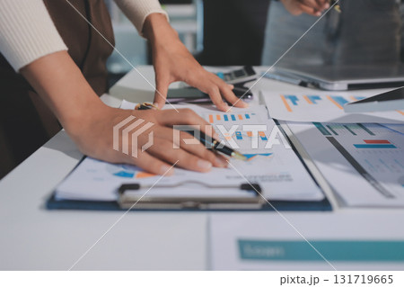 Accounting company provide finance and taxation planning for profitable cash flow, Auditor and accountant team working in office, analyze financial data and accounting record with calculator.Insight 131719665