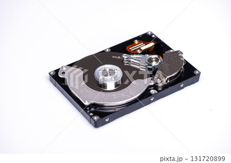 Close up inside of computer hard disk drive HDD isolated on white background Close up inside of computer hard disk drive HDD isolated on white background 131720899