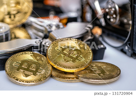 Bitcoin BTC on an open hard drive, cryptocurrency business concept, closeup Bitcoin BTC on an open hard drive, cryptocurrency business concept, closeup 131720904
