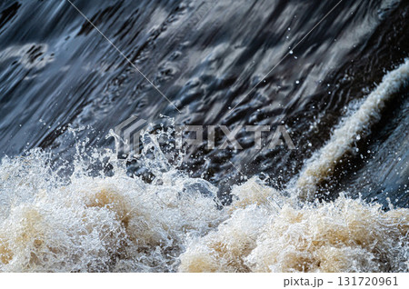 close up of flowing water, rapid water splashes of an white water river or stream, bubbly water close up of flowing water, rapid water splashes of an white water river or stream, bubbly water 131720961