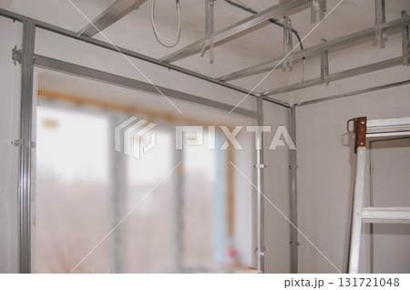 Drywall frame installation around window opening and on ceiling for renovation work. Drywall frame installation around window opening and on ceiling for renovation work. 131721048