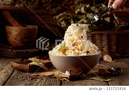 Traditional German sauerkraut on a old rustic wooden table. Traditional German sauerkraut on a old rustic wooden table. 131721916