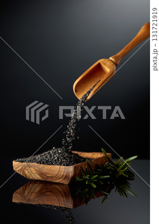 Black sesame on a black reflective background. Black sesame on a black reflective background. 131721919