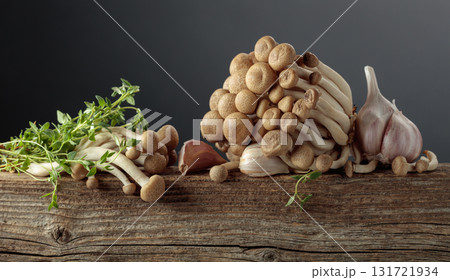 Fresh shimeji mushrooms with thyme and garlic. Fresh shimeji mushrooms with thyme and garlic. 131721934