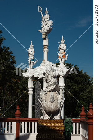 Giant statue and cement pole at Tha Mai temple, Thailand Giant statue and cement pole at Tha Mai temple, Thailand 131722873