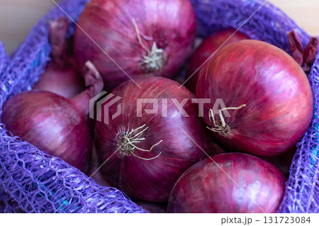 Red Onion Lying On Wooden Background, Harvest Season, spice. Red Onion Lying On Wooden Background, Harvest Season, spice. 131723084