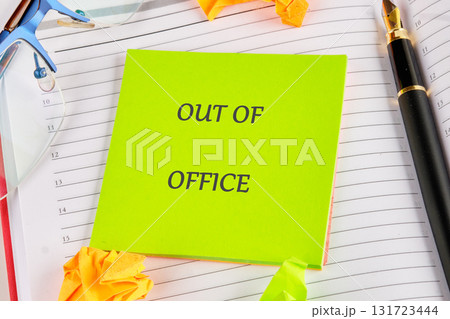 A day planner displays a vibrant out of office note. Also shown are glasses, a pen, and crumpled paper. This denotes a vacation from a Business in the City A day planner displays a vibrant out of office note. Also shown are glasses, a pen, and crumpled paper. This denotes a vacation from a Business in the City 131723444