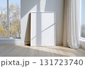 Blank frame for wall art mockup leanings against a sunny wall in a bright room with soft curtains and a view of autumn trees 131723740