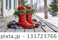 Western Christmas with festive red cowboy boots adorned with greenery and lights on a snowy porch in the heart of winter 131723766