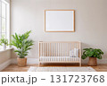 Blank frame for wall art mockup in a modern nursery showcasing a neutral beige design with wooden crib and greenery. 131723768