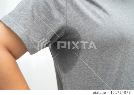 Sweaty underarms, Asian woman with sweat on clothes under armpit. 131724078