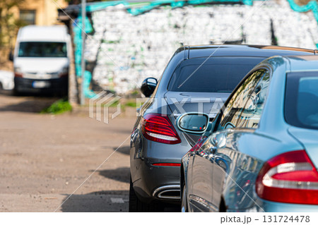 the yard of the city residential area is filled with parked cars the yard of the city residential area is filled with parked cars 131724478