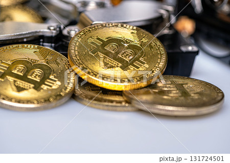 Bitcoin BTC on an open hard drive, cryptocurrency business concept, closeup 131724501
