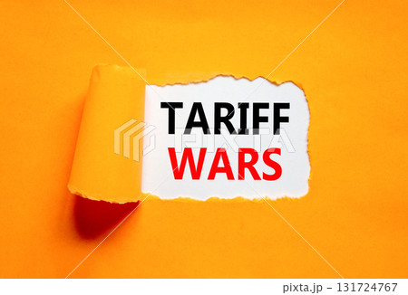 Trade tariff wars symbol. Concept word Tariff wars on beautiful white paper. Beautiful orange paper background. Business trade tariff wars concept concept. Copy space. Trade tariff wars symbol. Concept word Tariff wars on beautiful white paper. Beautiful orange paper background. Business trade tariff wars concept concept. Copy space. 131724767