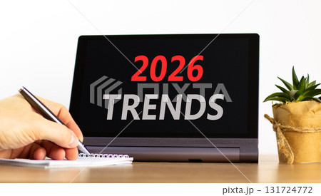 2026 Trends new year symbol. Concept words 2026 Trends on beautiful black tablet screen. Beautiful white background. Businessman's hand. Business and 2026 Trends new year concept. Copy space. 131724772