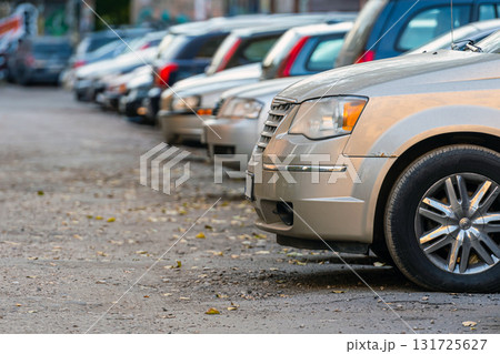 the yard of the city residential area is filled with parked cars the yard of the city residential area is filled with parked cars 131725627