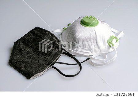 ffp2 and ffp3 protective face mask on a light background, closeup ffp2 and ffp3 protective face mask on a light background, closeup 131725661
