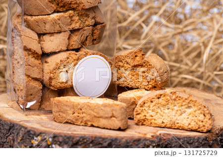 crispy rusk or toast on a dry straw background, closeup 131725729