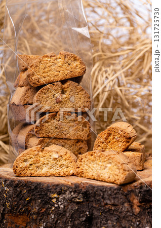 crispy rusk or toast on a dry straw background, closeup 131725730