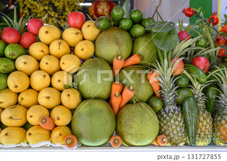 Apples, carrots and tropical fruits: mango, avocado, guava, pomelo, pineapples, pomegranates Apples, carrots and tropical fruits: mango, avocado, guava, pomelo, pineapples, pomegranates 131727855
