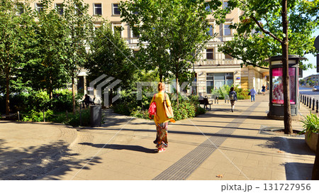 Warsaw, Poland. 21 September 2025. Chmielna in downton lined with granite slabs and planted with plants and shrubs street. City promenade during summer day. City architecture with shops and greenery. Warsaw, Poland. 21 September 2025. Chmielna in downton lined with granite slabs and planted with plants and shrubs street. City promenade during summer day. City architecture with shops and greenery. 131727956