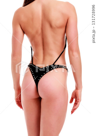 Young beautiful athletic girl with sexy body in bikini. Isolated on white background. 131728996