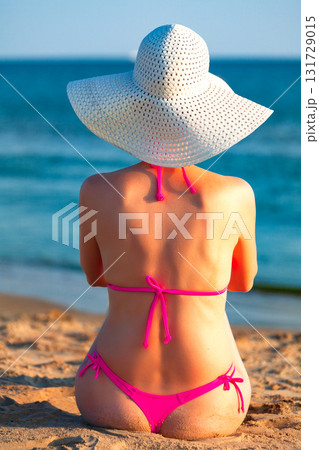 Sexy woman posing on a sea beach 131729015