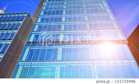 Bottom up view of  modern glass office building. Commercial real estate. New commercial office building in modern city. 131729496