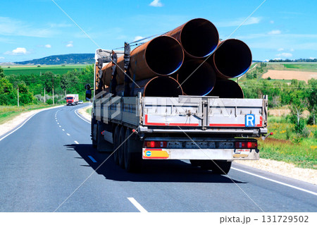 Picture of big truck with the trailer moves on the highway Picture of big truck with the trailer moves on the highway 131729502