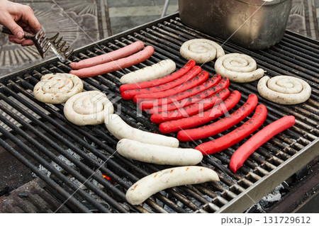 Closeup shot of the sausages on a grill Closeup shot of the sausages on a grill 131729612