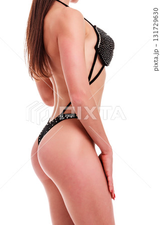 Young beautiful athletic girl with sexy body in bikini. Isolated on white background. 131729630