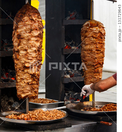 Closeup picture of stacked meat roasting, shawarma 131729643
