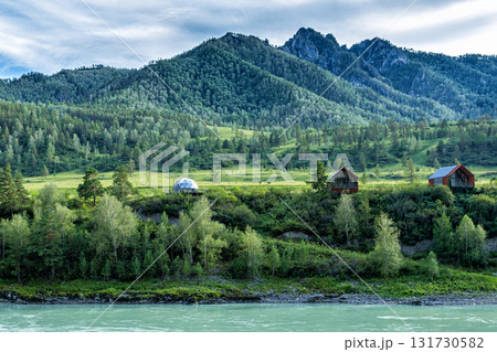 A turquoise river and picturesque forested mountains. Glamping on the riverbank 131730582