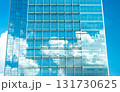 Skyscraper reflections merge clouds and glass into a vision of modern harmony. 131730625