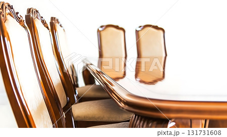 A wooden dining table with six chairs around it 131731608