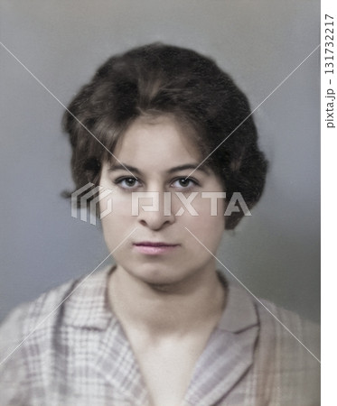 Vintage portrait of a serious young woman with a hairstyle. Retro photograph, 1962. Vintage portrait of a serious young woman with a hairstyle. Retro photograph, 1962. 131732217