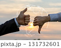 Hands expressing approval and disapproval at sunset. 131732601