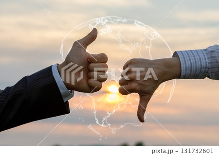 Hands expressing approval and disapproval at sunset. Hands expressing approval and disapproval at sunset. 131732601