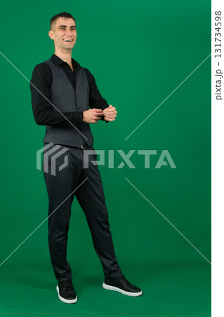 Set of videos with handsome European businessman in classic suit vest and black shirt showing different emotions gestures and confident poses on green chroma key background with copy space 131734598