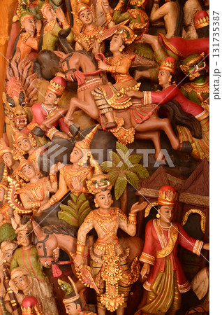 Wood carvings in Thai art on pillars in the temple church at Wat Den Sali Si Mueang Kaen temple or Wat Ban Den temple. Located at Chiang Mai Province in Thailand. 131735387