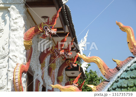 Wat Nong Jab Tao is a temple with a beautiful white ordination hall. It stands out with its beautiful stucco art of Naga sculptures in the surrounding area. 131735759