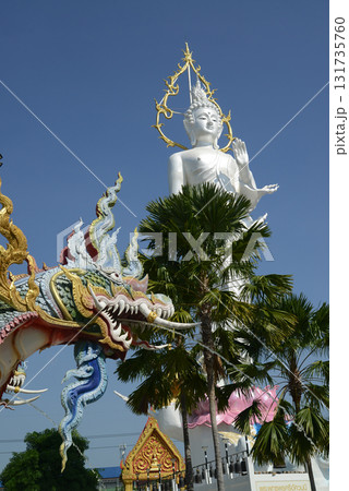 Phra Phutthaphon Sri Asvamuni, a 28-meter-high standing Buddha statue bestowing blessings at Wat Nong Jab Tao is a temple with a beautiful white ordination hall. Phra Phutthaphon Sri Asvamuni, a 28-meter-high standing Buddha statue bestowing blessings at Wat Nong Jab Tao is a temple with a beautiful white ordination hall. 131735760