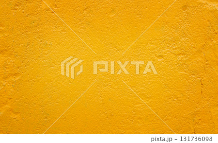 Yellow textured wall background with rough surface and copy space 131736098