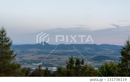 Wide landscape view of mountains and valley at dusk Wide landscape view of mountains and valley at dusk 131736119