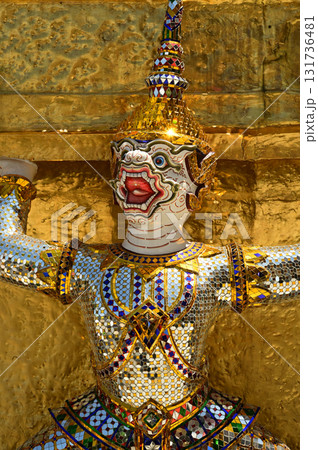 The large monkey giant guardian standing guard carrying the pagoda base at Wat Phra Kaew Temple of the Emerald Buddha is a famous tourist attraction. Bangkok Thailand. 131736481
