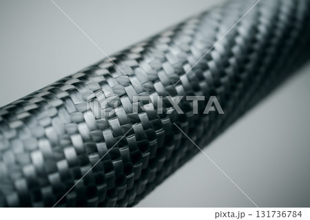 AI generated close-up of carbon fiber weave, showcasing its intricate texture and modern design. Perfect for technology and industrial themed visuals. Sharp focus clear presentation. 131736784